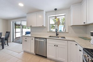Fridge, microwave, oven, stovetop - Pure Bliss: Heated Pool, Lanai, Walk to Beach (Anna Maria)