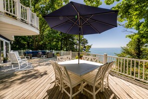 Outdoor dining - Colossal Lakefront Home in Sawyer! (Sawyer)