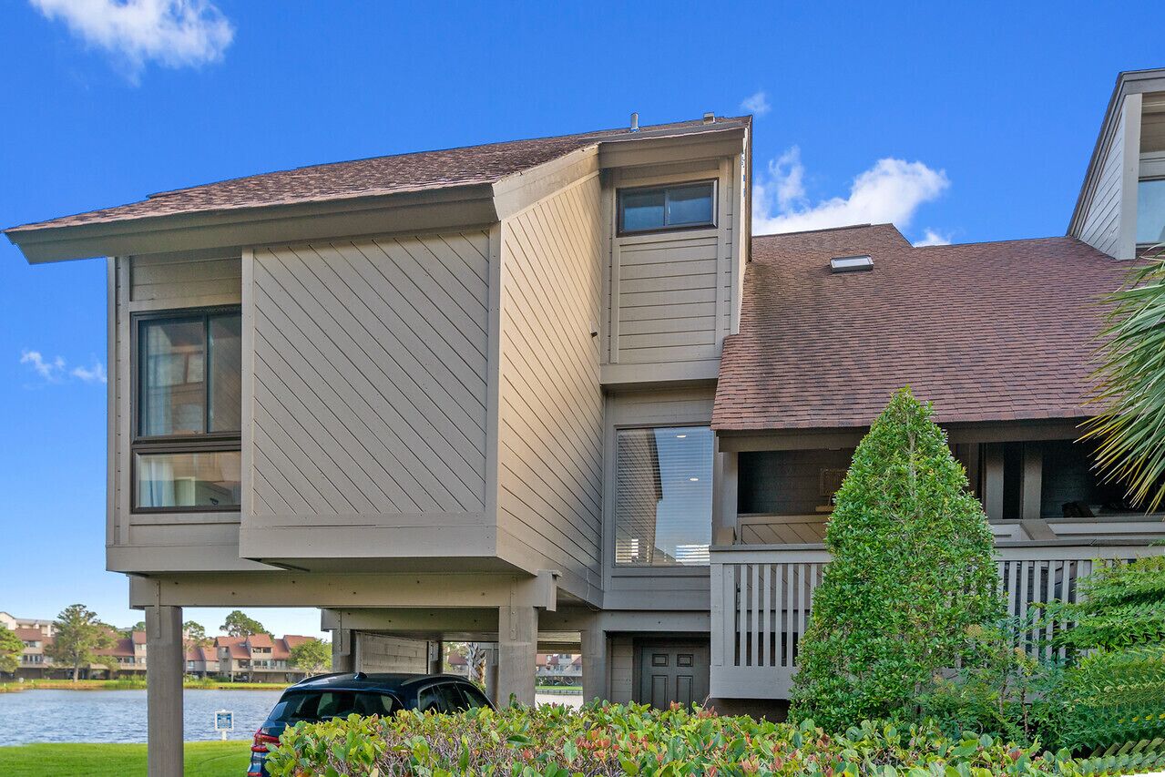 Villa with lake views and pool access located within gated Litchfield By the Sea community.