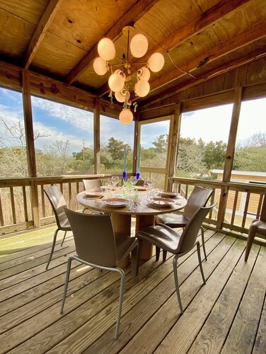 Someplace Else:  Cheerfully decorated island home with marsh views.