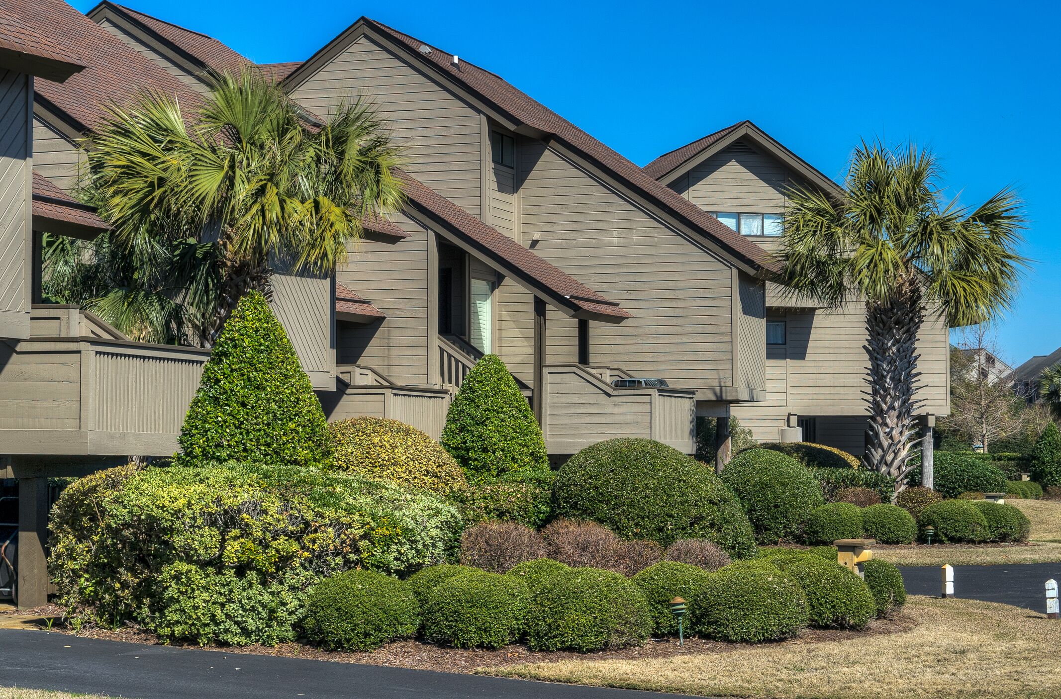 Villa with marsh views and pool access located within gated Litchfield By the Sea community.