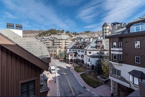 Take in snowy village and hillside views from the balcony. - Charlie Rentz: BC Village, Ski-In/Out, Remodeled + AC, Walk to Ski School, Lifts + Dining (Beaver Creek)