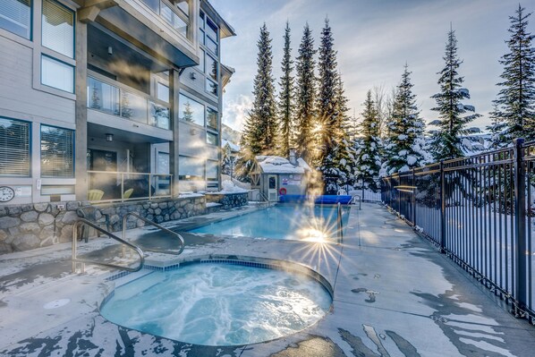Guests can enjoy a refreshing swim in the pool surrounded by a wall and accessible via a ladder.