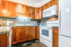 Fridge, microwave, oven, stovetop - Acer Vacations | Clean Renovated 2 Bedroom | Pool | W/D | Ski-in/Out | Greystone Lodge (Whistler)