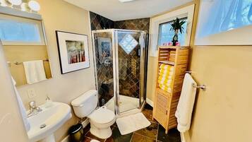 Shower, hair dryer, towels, soap