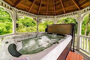 A hot tub with a wooden deck and a white gazebo structure. - Apple Blossom Cottage Of Gettysburg.  Hot Tub is an Add on Fee (Orrtanna)