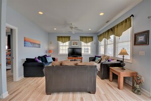 Flat-screen TV, DVD player, books, stereo