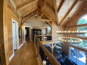 Experience the open and airy atmosphere of this multi-level space with a central staircase and expansive views through large windows.