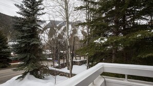 A snowy landscape with a road and a white railing. - Ski Storage, Garage and Free Shuttle (Warm Springs)