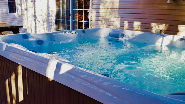 Relax in a hot tub on the outdoor deck.