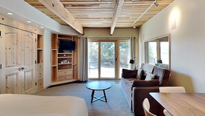 A modern room with a bed, a sofa, a dining table, and a TV. - 🌲Timberline 115 Studio Deluxe ~ Hot Tub~Pool~WiFi~Ski-in/out~Local Shuttle🌲 (Snowmass Village)