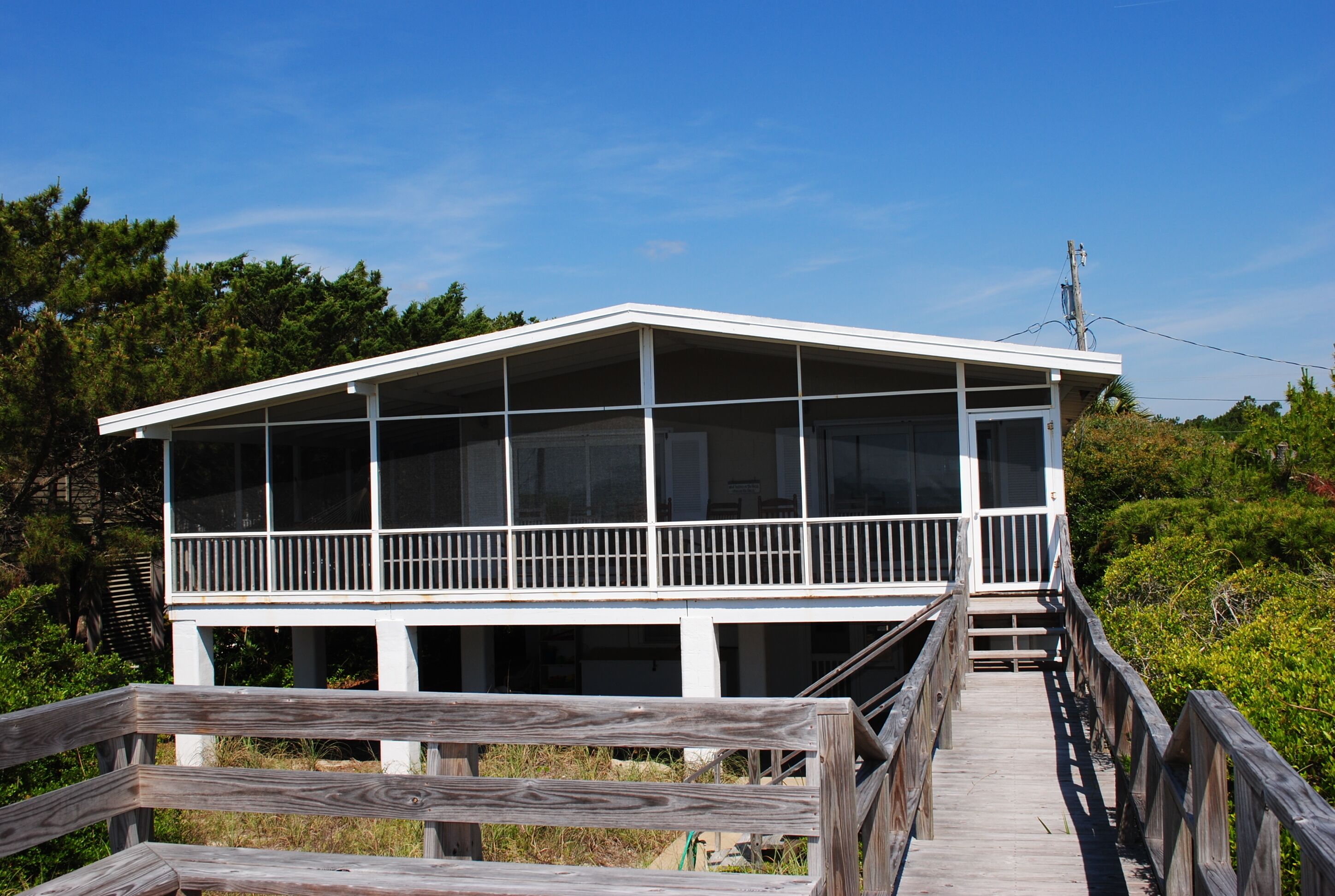 Oceanfront beach home with hammock and porch swing located at North Litchfield Beach.