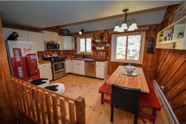 Kitchen w/ handmade table and copper countertops
