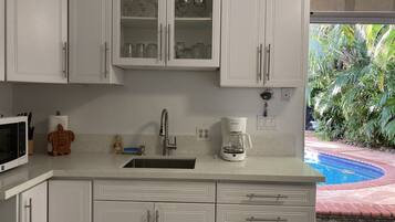 Fridge, microwave, coffee/tea maker, toaster