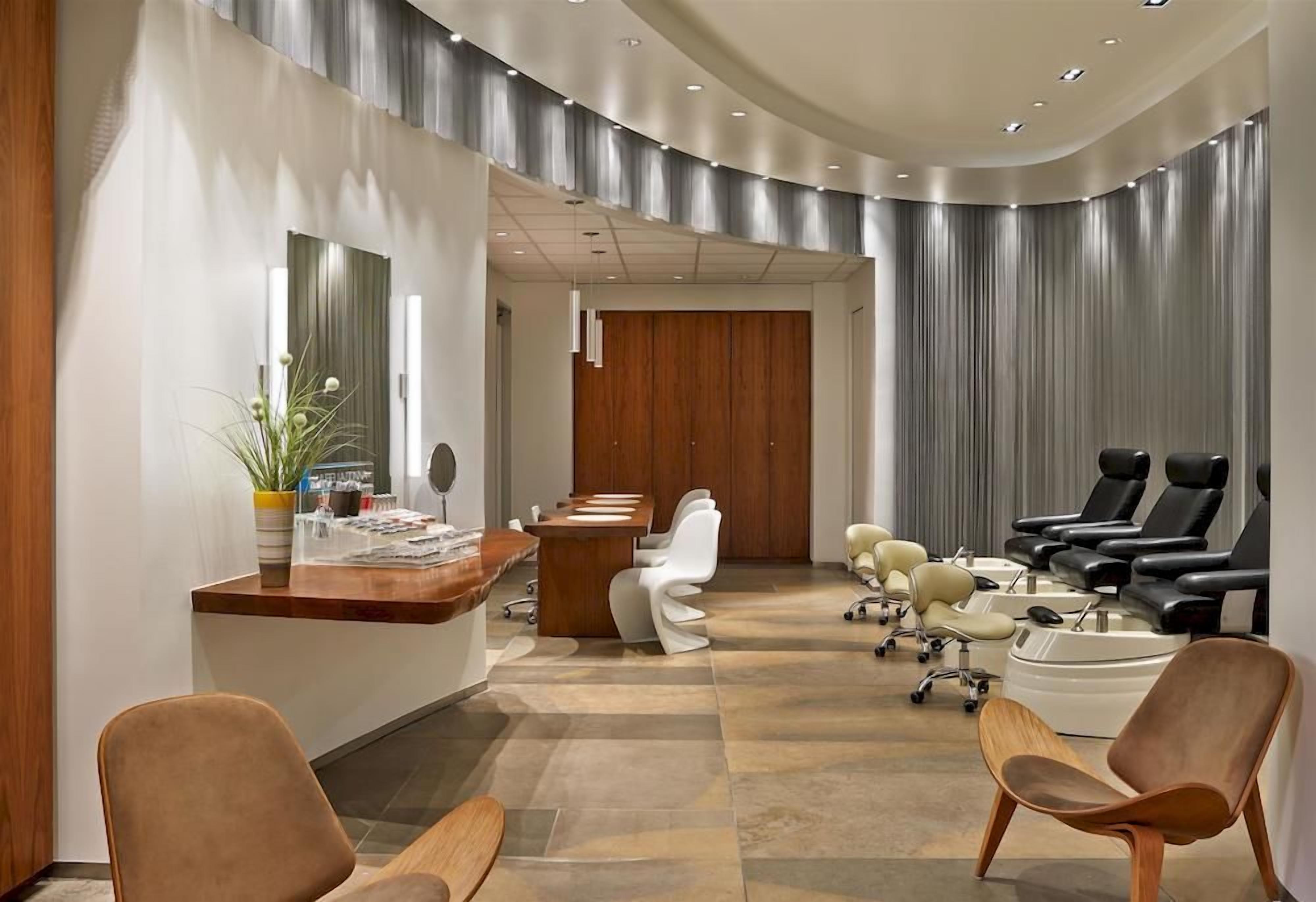 A modern dental office with a reception desk, waiting area, and treatment rooms.