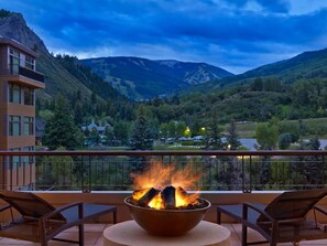 A balcony with a fire pit, overlooking a mountainous landscape. - Resort Ski In/Out Penthouse Studio/ Ski Valet (Avon)