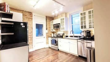 Fridge, coffee/tea maker, cookware/dishes/utensils, dining tables