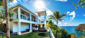 Enjoy breathtaking ocean views from the expansive balcony and relax in the serene tropical garden.