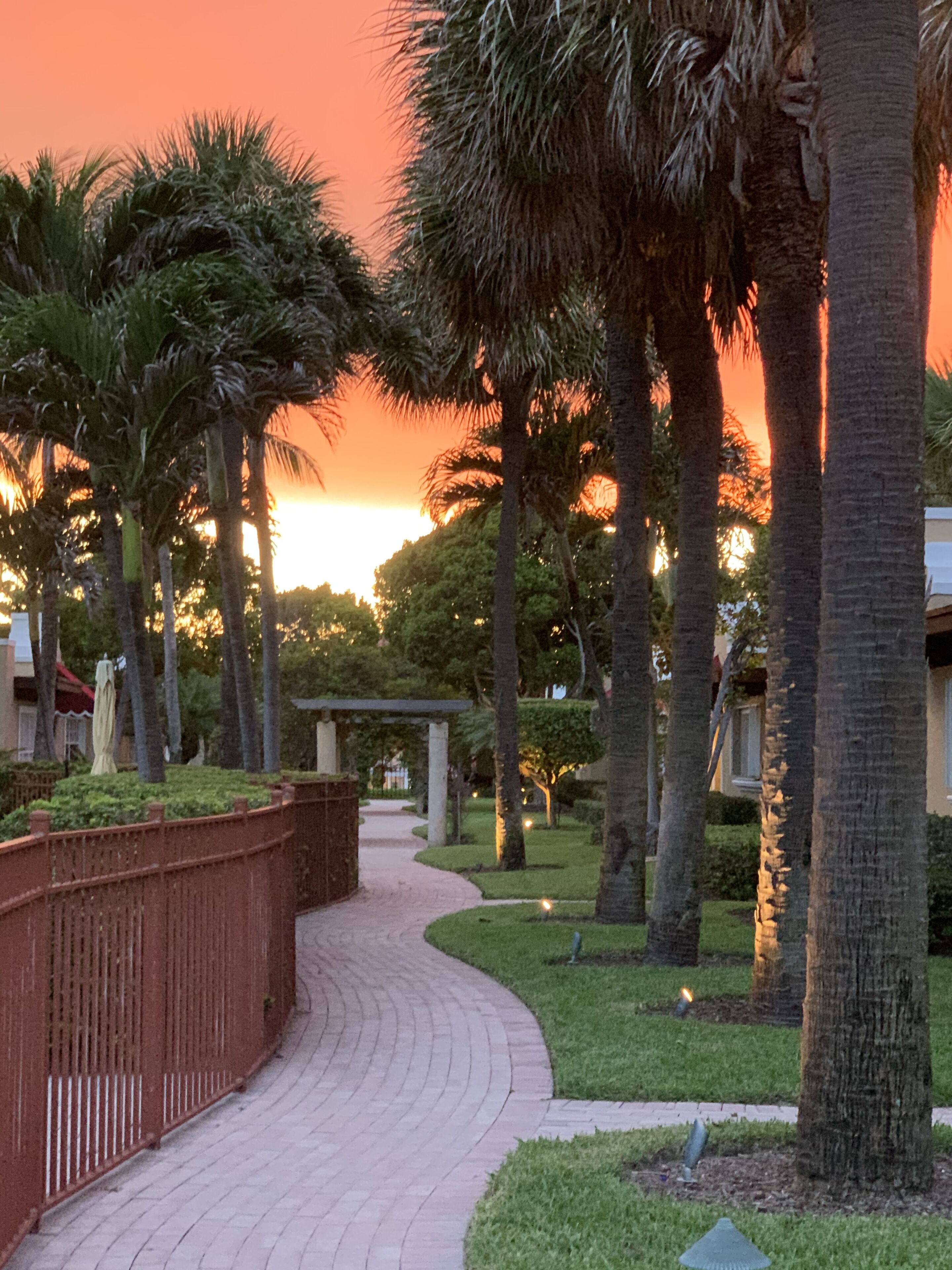 View of property looking West at dusk so image reflects sunset.   