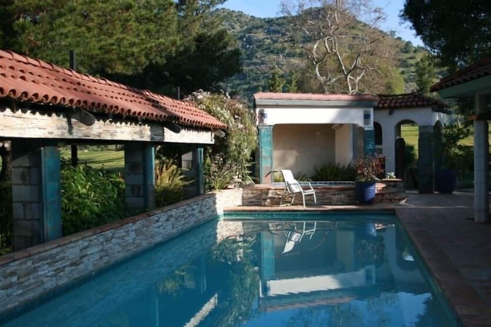 Three bedroom/three bath resort style home with saltwater pool and spa