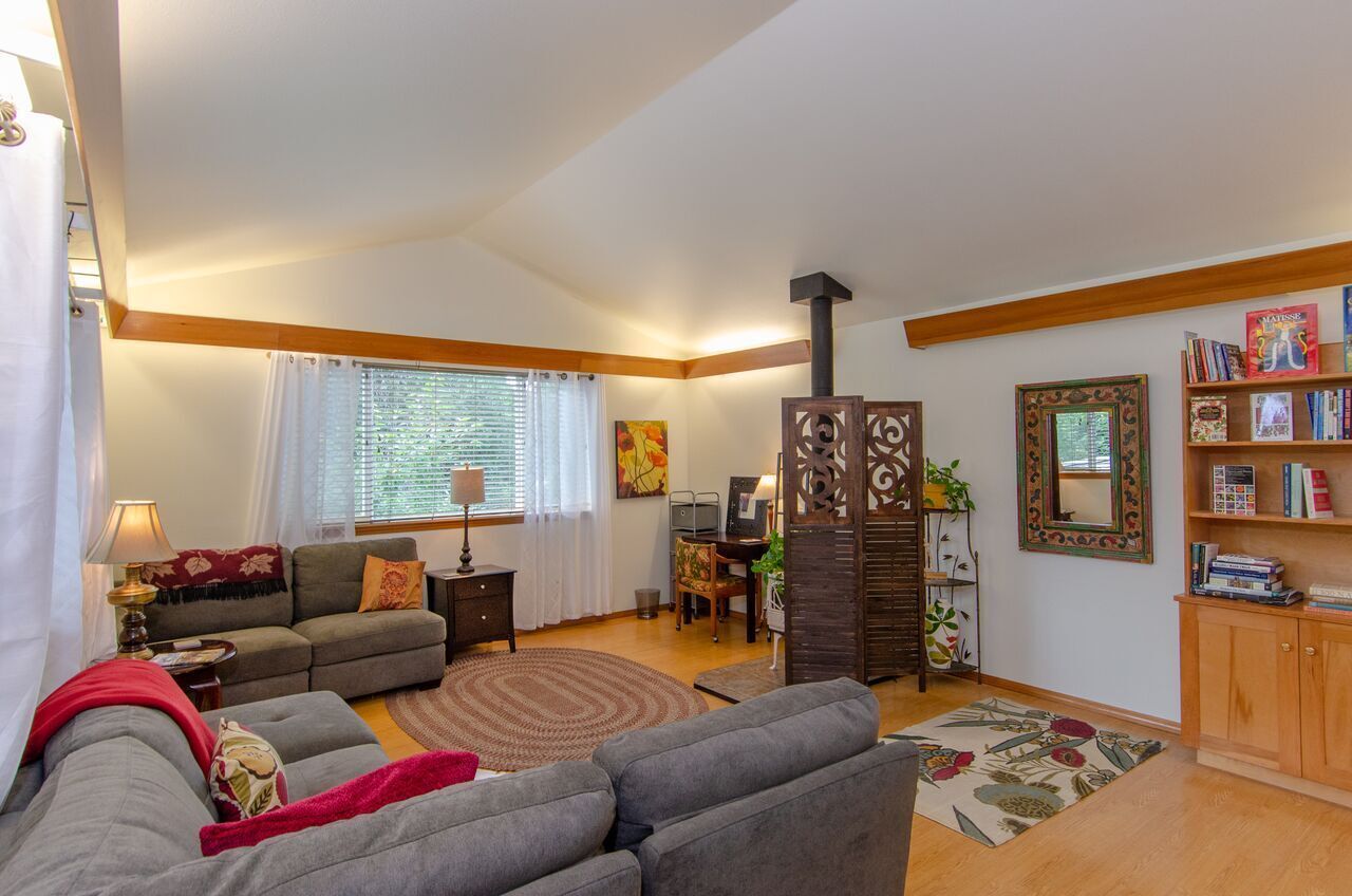 Large, bright livingroom w/library. (Reading 
/lounge area in separate photo.)
