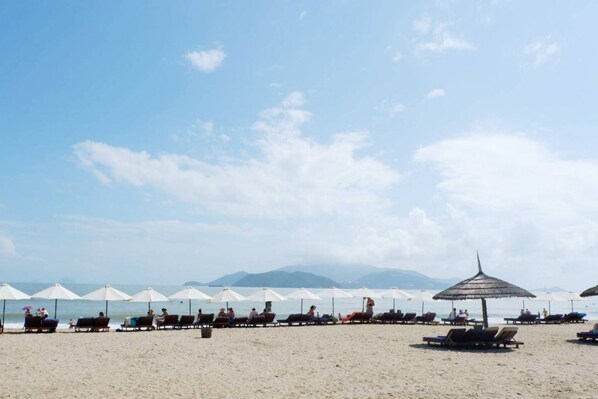 On the beach, sun-loungers