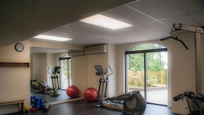 A gym with exercise equipment, a clock, and large windows. - Marquise on Blackcomb, Pool & Hot Tub, Easy Ski Access, Free WiFi (Whistler)