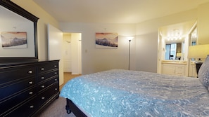 A bedroom with a bed, dresser, and a mirror. - Marquise on Blackcomb, Pool & Hot Tub, Easy Ski Access, Free WiFi (Whistler)