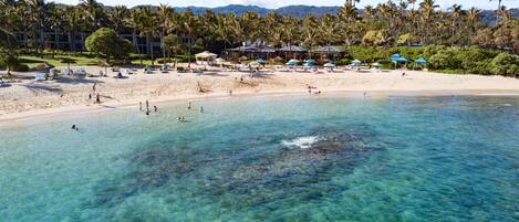 On the beach, sun loungers, beach towels