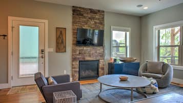 TV, fireplace, books