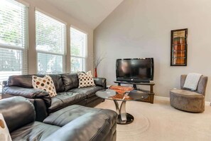 Flat-screen TV, fireplace, video games, table football