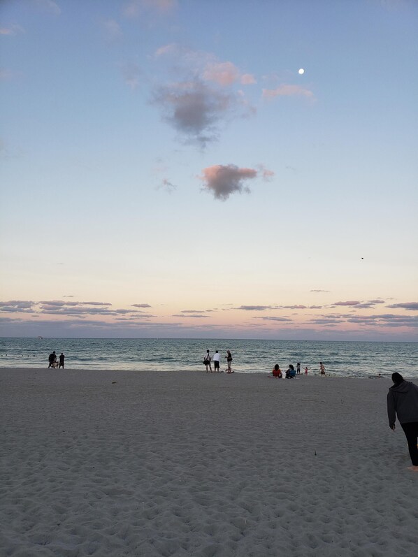 On the beach, sun loungers, beach towels