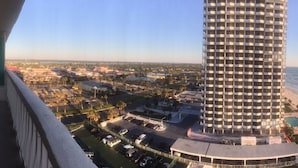 A high-rise hotel with a cylindrical design, located near a beach with a view of the ocean. - Spacious, updated 1 bed/1 bath condo with gorgeous ocean views (Daytona Beach)