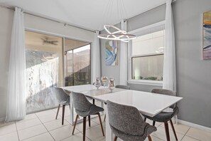 Enjoy meals in this stylish dining area with a large table and six comfortable chairs.
