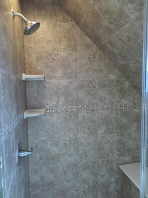 Shower, hair dryer, towels, toilet paper