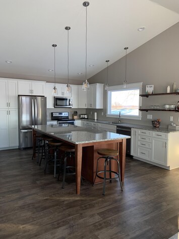 Kitchen with granite countertop and 4'x8' island.