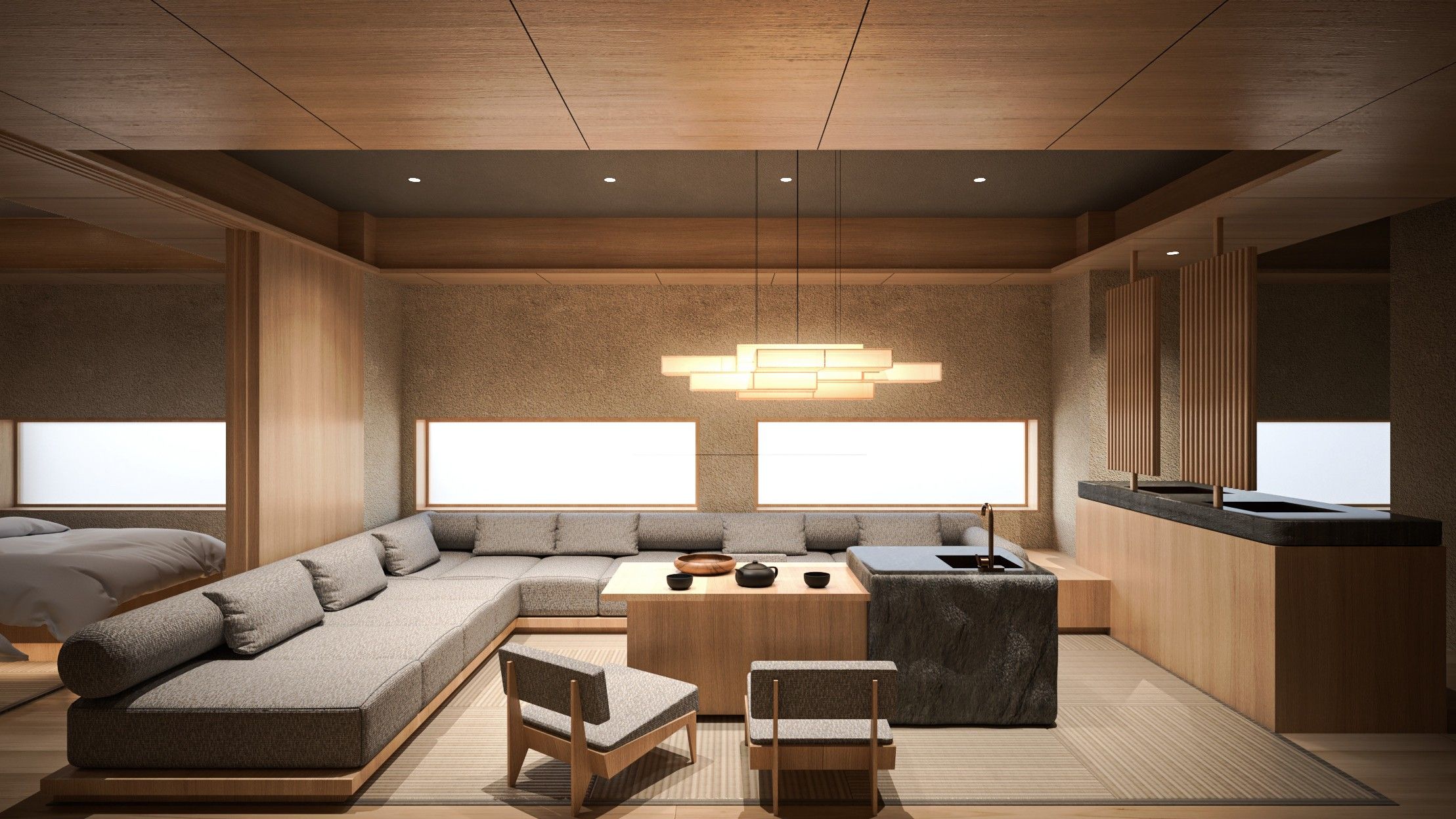 A modern interior with a sectional sofa, a small dining table, and a kitchen area.