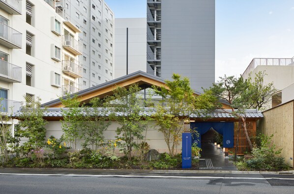 Traditional Japanese architecture meets modern urban charm in this serene residential building.