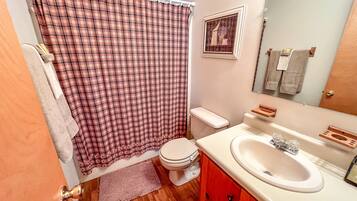 Bathtub, hair dryer, towels