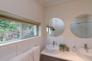 Bathtub, hair dryer, towels, soap