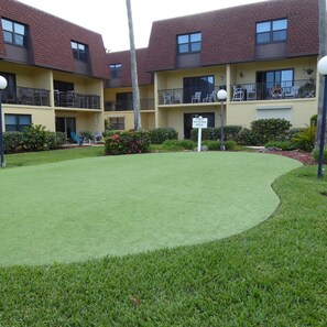 Property grounds - BEACHSIDE Paradise: 3BR Condo with Heated Pool - Steps to Cocoa Beach Pier! (Cocoa Beach)