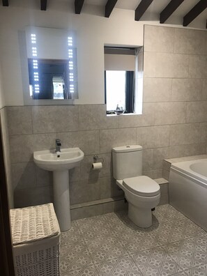 Combined shower/bathtub, hair dryer, towels, soap