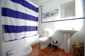 Bathtub, hair dryer, towels