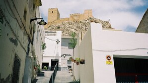 A narrow street leading to a historic castle atop a hill. - TRADITIONAL SPANISH TOWN HOUSE INLAND SAX ALICANTE. SLEEPS 6 BED WIFI (sax)