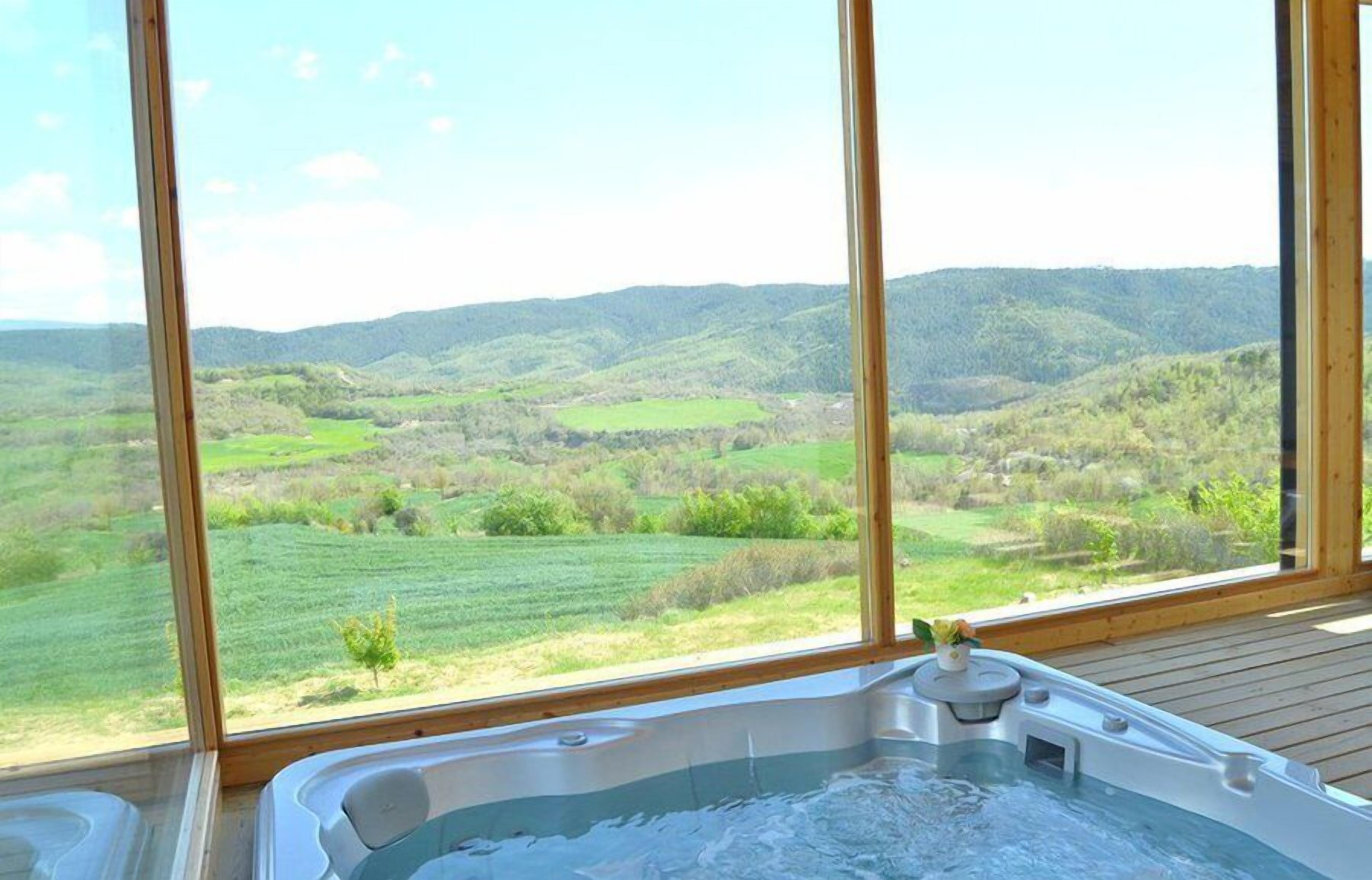 The glorious jacuzzi of the house from which you can lie and enjoy the view