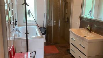 Combined shower/tub, hair dryer, towels, soap