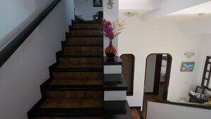 A staircase with a dark wooden finish and white walls. - Fabulous Detached Villa in Premier Location, Full Air Con, Heated Pool, Wi-Fi + (Puerto del Carmen)