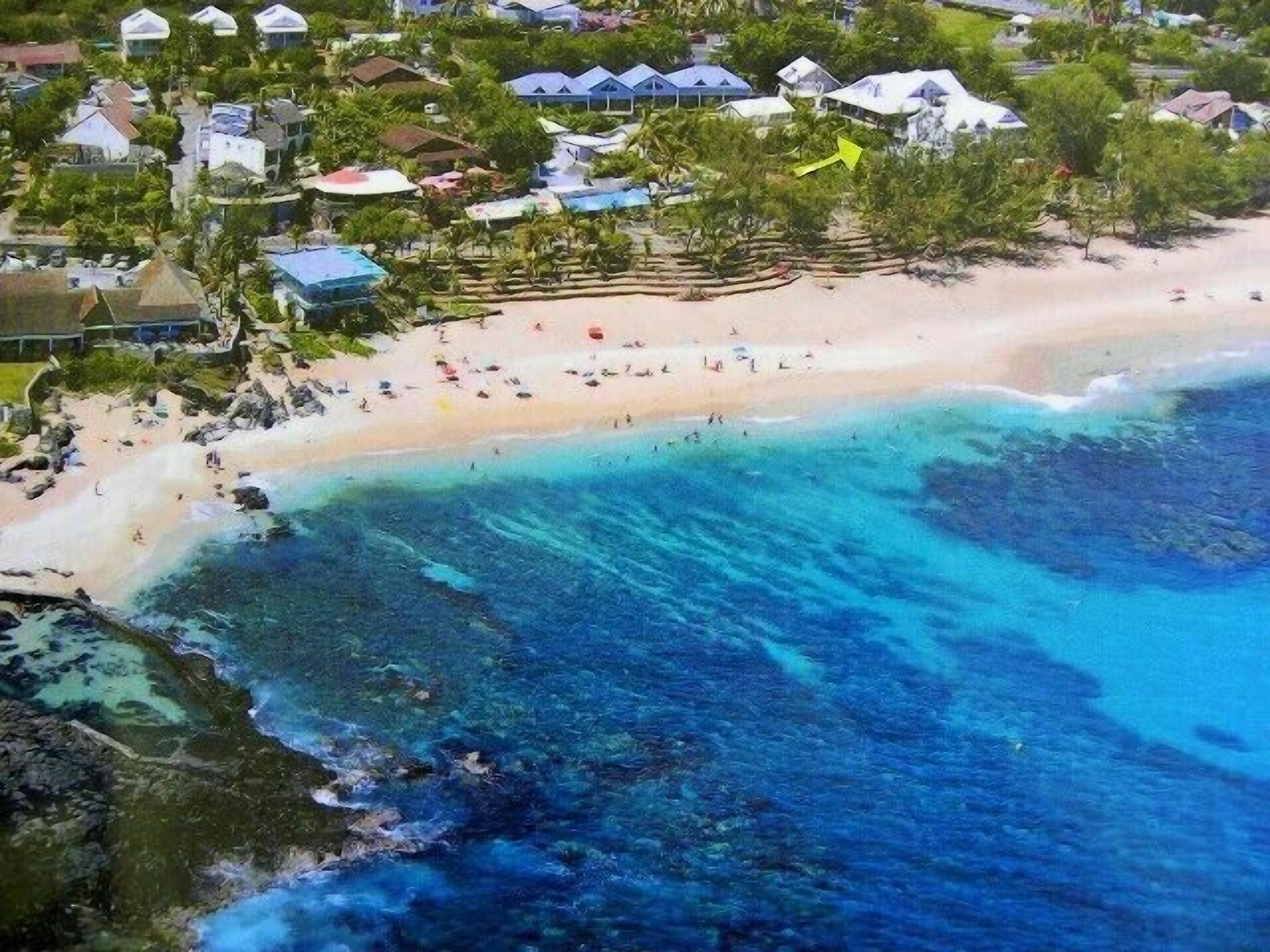 plage de Boucan Canot et emplacement appartement  marqué par la  flèche verte 