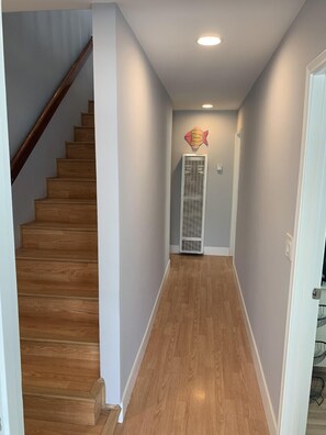 View from garage door leading upstairs to kitchen and family room/deck 