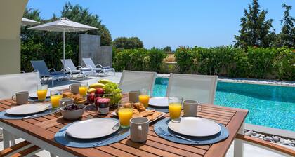 Lovingly furnished house in a quiet location with heated pool and sea views